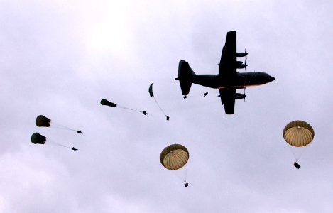 US Navy 050618-N-0000P-205 Australian Army Soldiers, assigned to the 3rd Royal Australian Regiment, conduct a dawn static line parachute jump from a C-130 Hercules aircraft