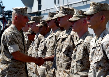 US Navy 050617-N-5313A-071 Commandant of the Marine Corps, Gen. Michael Hagee, recognizes selected Marines for their sustained superior performance