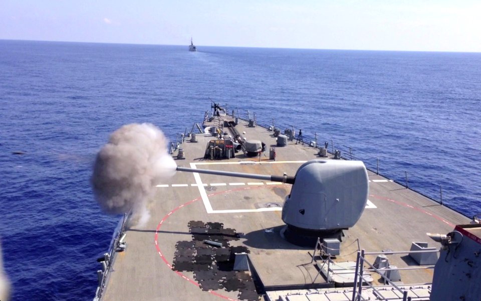 USS Barry fires its deck gun. (8788920088)