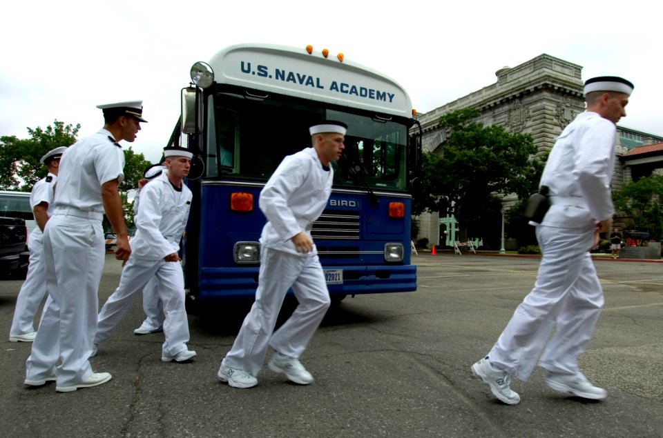 US Navy 050629-N-9693M-288 Prospective Midshipmen exit a bus under instruction from a 1st Class Midshipman prior to entering Bancroft Hall at the United States Naval Academy in Annapolis, Md