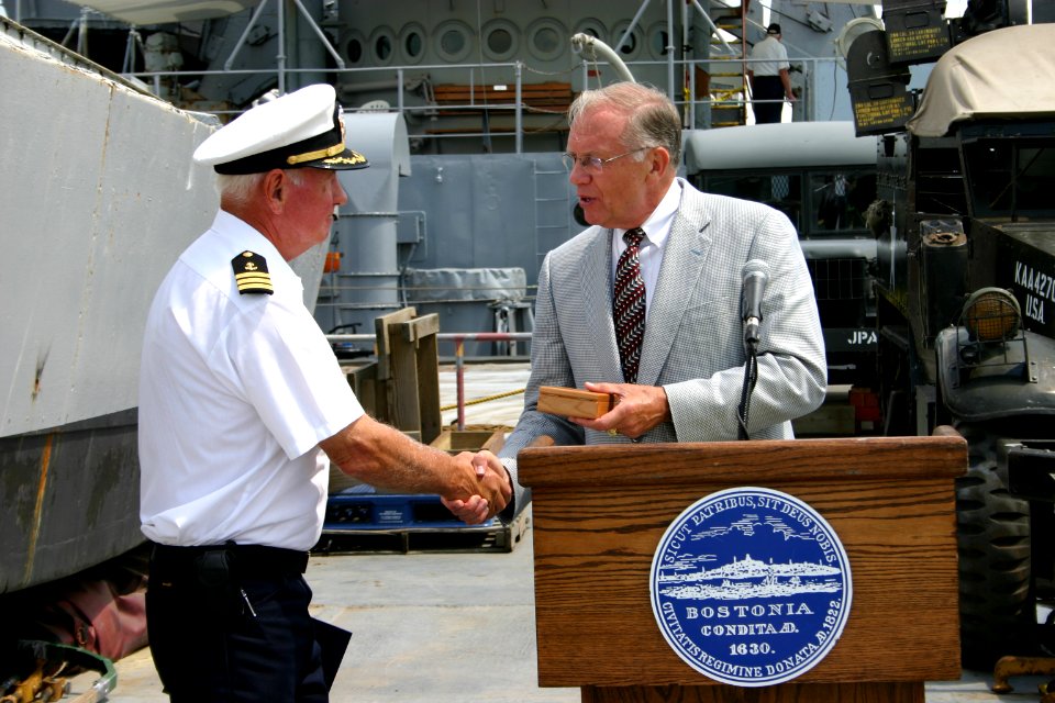 US Navy 050617-N-8110K-045 Special Assistant to the Secretary of the Army, Harry E. Soyster, right, presents LST Memorial Crew Captain Robert Jornlin with a World War II 60th anniversary commemoration medal