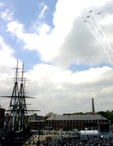 US Navy 050618-N-8110K-112 Four L-17 Navions from the Warbirds of America's Patriot Squadron conduct a formation flyover above the Bunker Hill monument and USS Constitution
