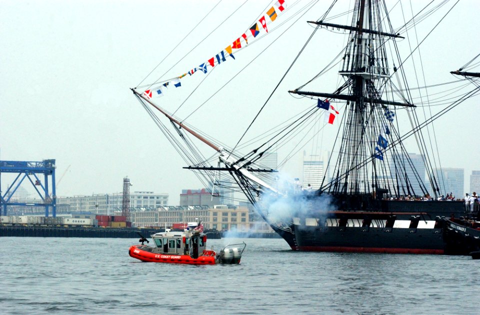 US Navy 050611-C-4938N-324 U.S. Coast Guard patrol boats and a tugboat escort USS Constitution, Old Ironsides, out to Island Castle Hill in south Boston prior to firing a 21-gun salute