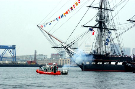 US Navy 050611-C-4938N-324 U.S. Coast Guard patrol boats and a tugboat escort USS Constitution, Old Ironsides, out to Island Castle Hill in south Boston prior to firing a 21-gun salute