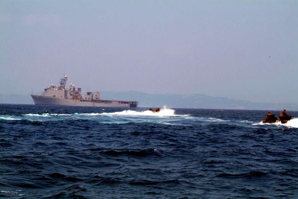 US Navy 050709-N-4772B-056 A pair of Armored Amphibious Vehicles (AAV) assigned to the 31st Marine Expeditionary Unit (MEU) make their approach to the well deck of the amphibious dock landing ship USS Harpers Ferry (LSD 49)