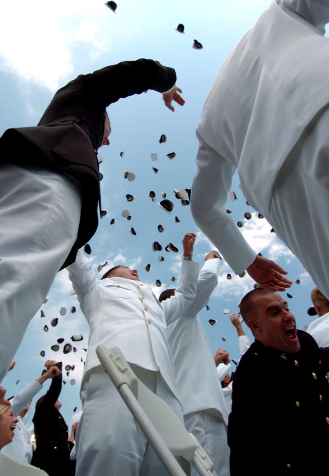 US Navy 050527-N-9693M-005 Newly commissioned officers celebrate their new positions by throwing their Midshipmen covers into the air as part of the U.S. Naval Academy class of 2005 Graduation and Commissioning Ceremony