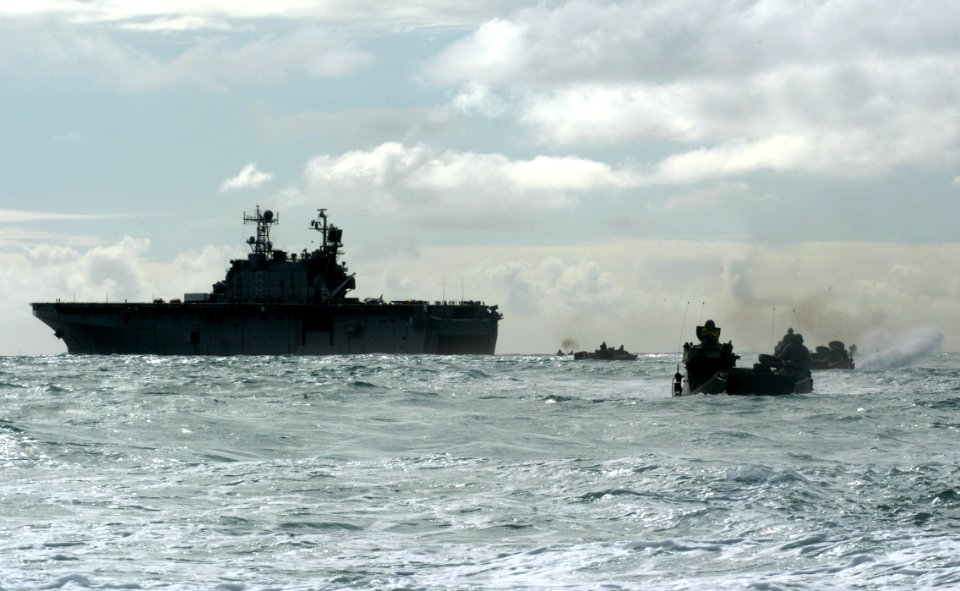 US Navy 050627-N-9866B-009 Amphibious assault vehicles travel through the Pacific Ocean after departing the amphibious assault ship USS Peleliu (LHA 5)