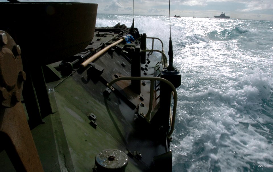 US Navy 050627-N-9866B-017 U.S. Marine Corps amphibious assault vehicles travel through the Pacific Ocean