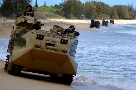 US Navy 050628-N-9866B-009 U.S. Marines assigned to 3rd Amphibious Assault Battalion, drive their Amphibious Assault Vehicles (AAVs) down the beach