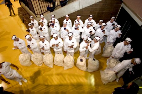 US Navy 050629-N-9693M-767 First day Midshipmen stand at attention while reading Reef Points, the manual for Midshipmen at the United States Naval Academy in Annapolis, Md