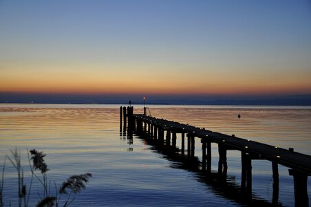 Sunset jetty sky water photo