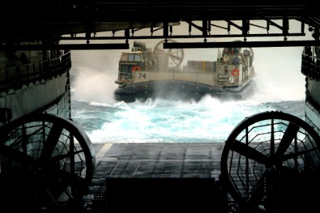 US Navy 050707-N-4772B-024 A Landing Craft, Air Cushion (LCAC), assigned to Assault Craft Unit Five (ACU-5), makes its approach into the well deck aboard the amphibious dock landing ship USS Harpers Ferry (LSD 49) photo