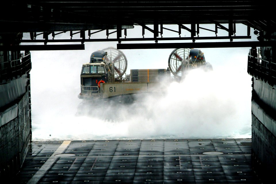 US Navy 050707-N-4772B-010 A Landing Craft, Air Cushion (LCAC), assigned to Assault Craft Unit Five (ACU-5), makes its approach into the well deck aboard the amphibious dock landing ship USS Harpers Ferry (LSD 49)