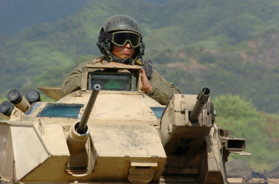US Navy 050627-N-9866B-021 A Marine assigned to the 3rd Amphibious Assault Battalion based at Camp Pendelton, Calif., mans the turrets of his amphibious assault vehicle (AAV)