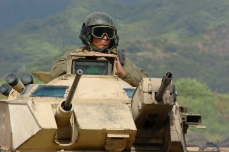 US Navy 050627-N-9866B-021 A Marine assigned to the 3rd Amphibious Assault Battalion based at Camp Pendelton, Calif., mans the turrets of his amphibious assault vehicle (AAV) photo