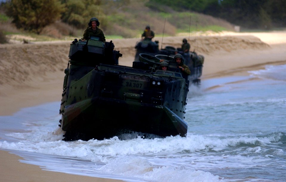 US Navy 050628-N-9866B-010 U.S. Marines assigned to 3rd Amphibious Assault Battalion, drive their Amphibious Assault Vehicles (AAVs) down the beach