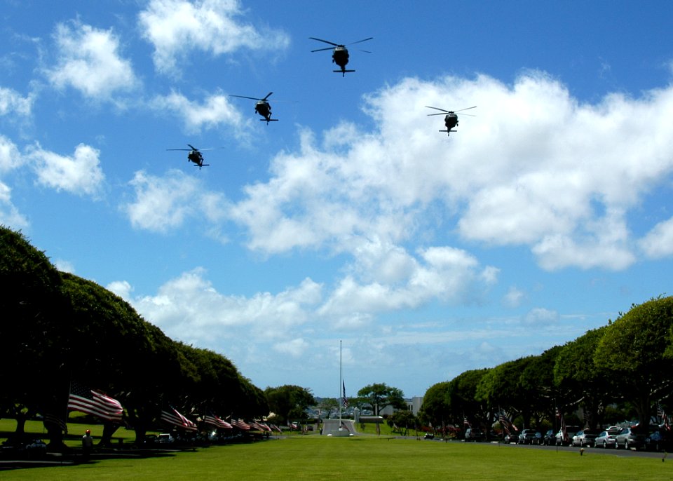 US Navy 050711-N-3019M-010 Four U.S. Army UH-60 Black Hawk helicopters conduct a flyover during a memorial service for five Sailors assigned to SEAL Delivery Vehicle Team One (SDVT-1)