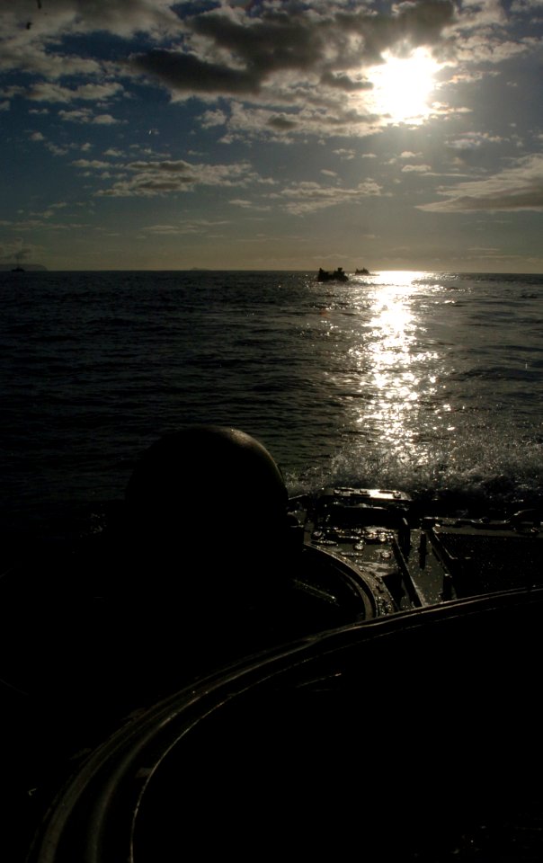 US Navy 050628-N-9866B-052 U.S. Marine Corps Lance Cpl. Joseph Westby, assigned to the 3rd Amphibious Assault Battalion, drives an amphibious assault vehicle through the Pacific Ocean