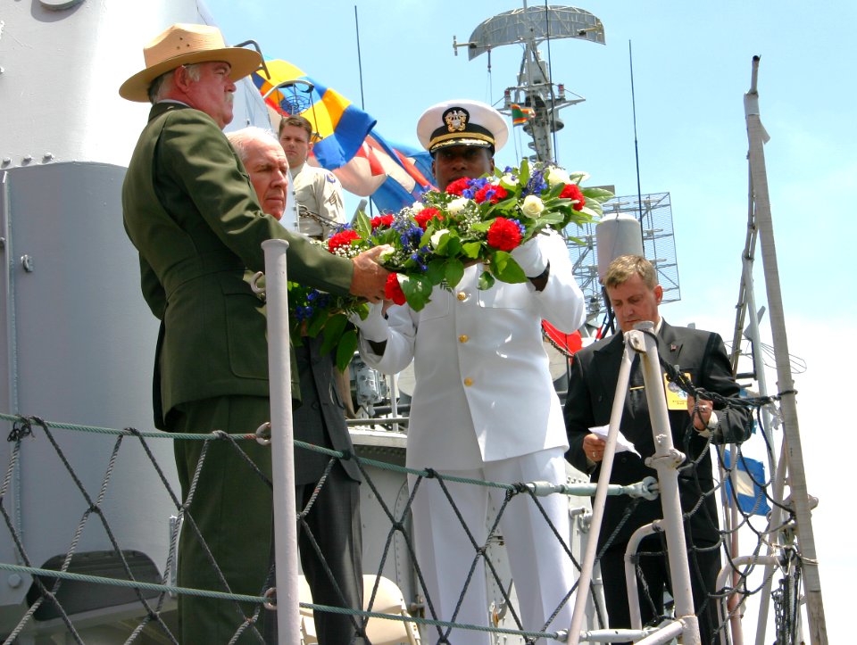 US Navy 050618-N-8110K-056 Boston National Historical Park Supervisor of Interpretation, Bill Foley, Retired Navy pilot and Medal of Honor recipient, Capt. Thomas Hudner, and Commanding Officer, USS Constitution Cmdr. Lewin Wri