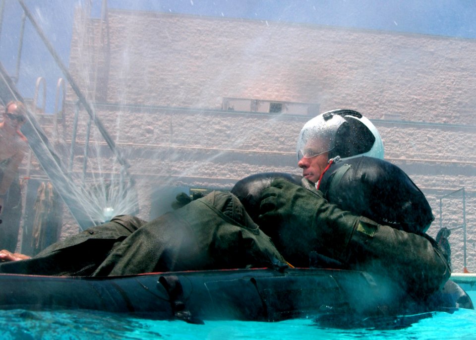 US Navy 050623-N-9500T-183 A student attending the refresher course in water survival at Aviation Survival Training Center, Marine Corps Air Station Miramar, awaits simulated rescue