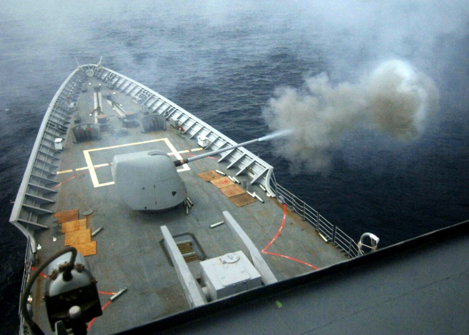US Navy 050713-N-4374S-001 The guided missile cruiser USS Thomas S. Gates (CG 51) fires a training round from an MK-45 5-inch-54 caliber lightweight gun during a live fire exercise in the Pacific Ocean