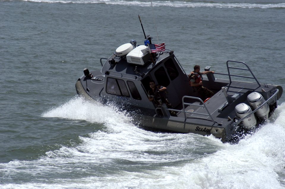 US Navy 050729-N-8154G-030 Sailors assigned to Naval Station Ingleside, Texas, make a high-speed turn while patrolling the waters near the base in a SeaArk boat