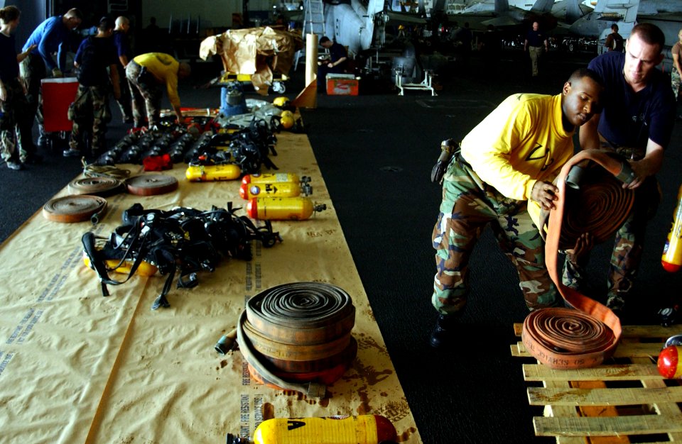 US Navy 050719-N-0413R-046 Air Department personnel inventory damage control equipment in the hangar bay aboard the nuclear-powered aircraft carrier USS Nimitz (CVN 68)