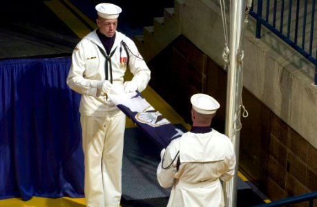 US Navy 050722-N-0295M-012 U.S. Navy honor guardsmen fold the retired Chief of Naval Operations Vern Clark's flag after the reading of his official orders during the Chief of Naval Operations change of command ceremony