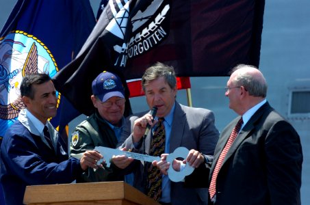 US Navy 050801-N-7676W-629 San Diego Congressmen welcome Chairman of the Board, President and Chief Executive Officer of Titan Corporation, Dr. Gene W. Ray, right, to the podium during a welcoming ceremony for Sea Fighter (FSF