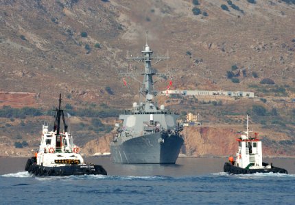 US Navy 050720-N-0780F-006 Tug boats head out to meet the guided missile destroyer USS Mahan (DDG 72) as she arrives in S Souda Bay for a routine port visit