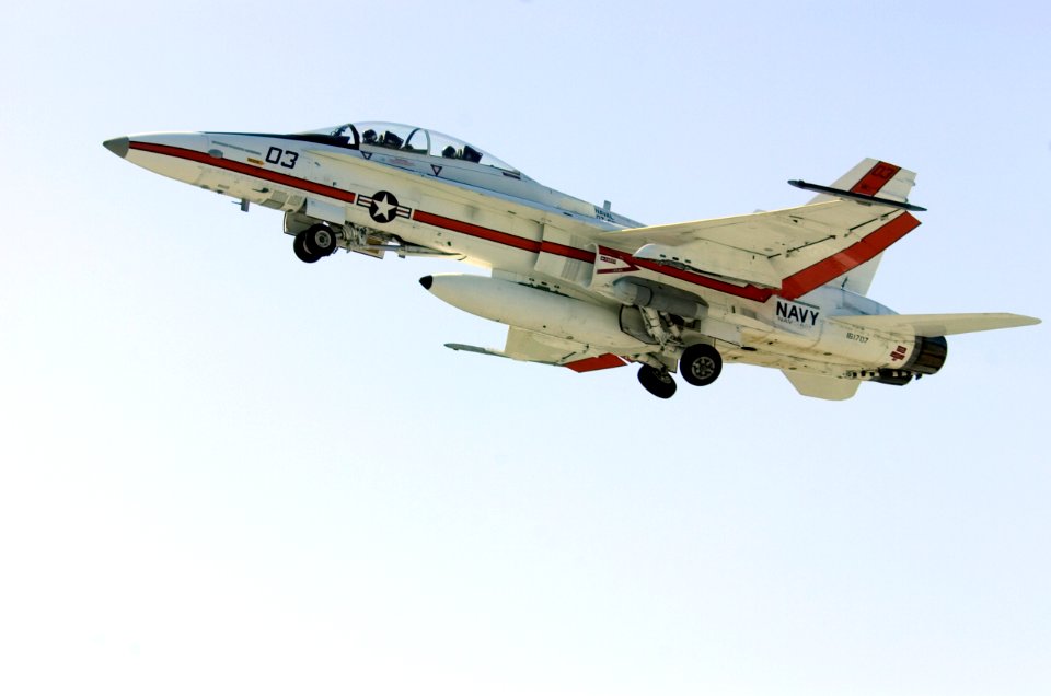 US Navy 050803-N-0295M-148 An F-A-18B Hornet, assigned to the U.S. Naval Test Pilot School, folds-up its landing gear after taking off for a training flight from Naval Air Station Patuxent River, Md