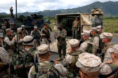 US Navy 050627-N-9866B-035 Third Amphibious Assault Battalion Company Commander, Capt. Benjamin Venning, talks to his Marines after they finished training with their amphibious assault vehicles (AAVs)