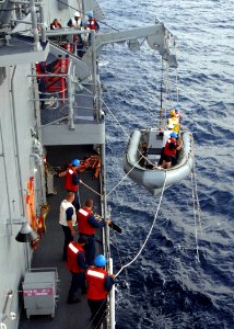 US Navy 050712-N-4374S-002 Sailors assigned to the guided missile frigate USS Samuel B. Roberts (FFG 58) lower a Rigid Hull Inflatable Boat (RHIB) for small boat operations in the Pacific Ocean