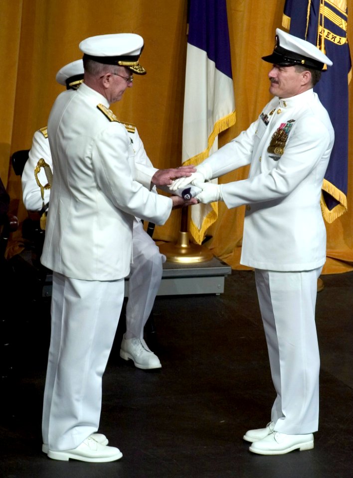 US Navy 050722-N-0295M-013 Master Chief Petty Officer of the Navy (MCPON) Terry Scott presents Adm. Vern Clark's retired Chief of Naval Operations flag