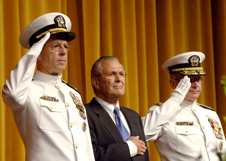 US Navy 050722-N-5390M-001 Secretary of Defense Donald Rumsfeld, center, Adm. Vern Clark, right, Chief of Naval Operations (CNO) and Adm. Mike Mullen salute the colors during a late-morning change-of-command ceremony
