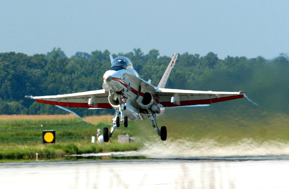 US Navy 050803-N-0295M-137 An F-A-18B Hornet, assigned to the U.S. Naval Test Pilot School, takes off for a training flight from Naval Air Station Patuxent River, Md