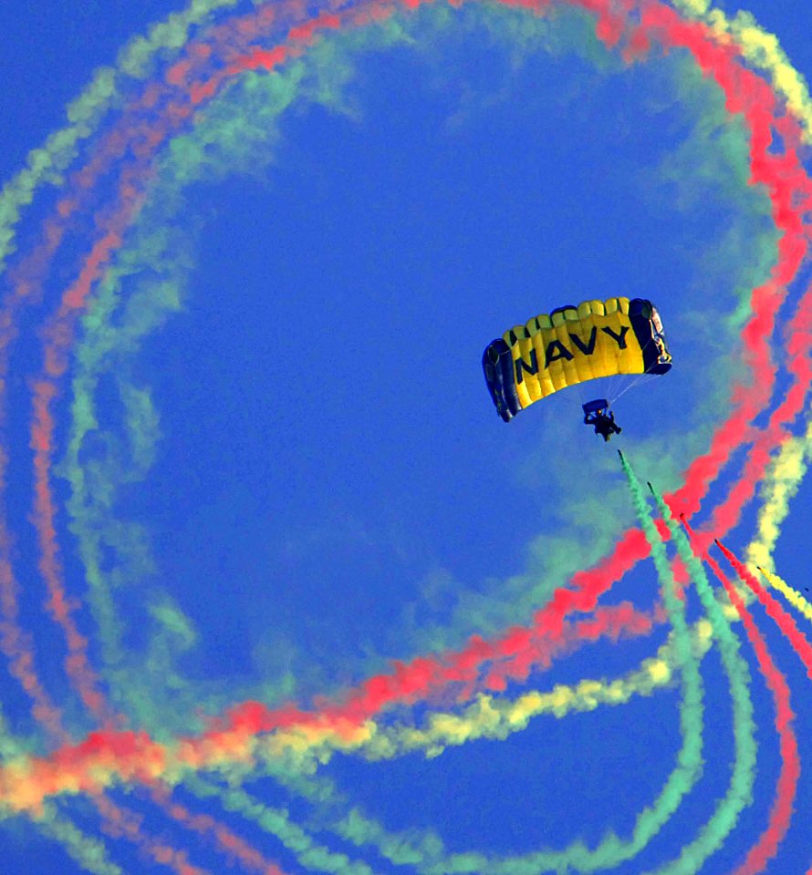 US Navy 050806-N-9769P-003 A Member of the U.S. Navy Parachute Team, the Leap Frogs, descends over downtown Los Angles during the 2005 Extreme Games