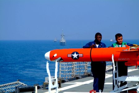 US Navy 050728-N-4772B-047 Members of Fleet Activities, Okinawa's drone detachment monitor a BQM-74E aerial drone target during the Indonesia phase of exercise Cooperation Afloat Readiness and Training