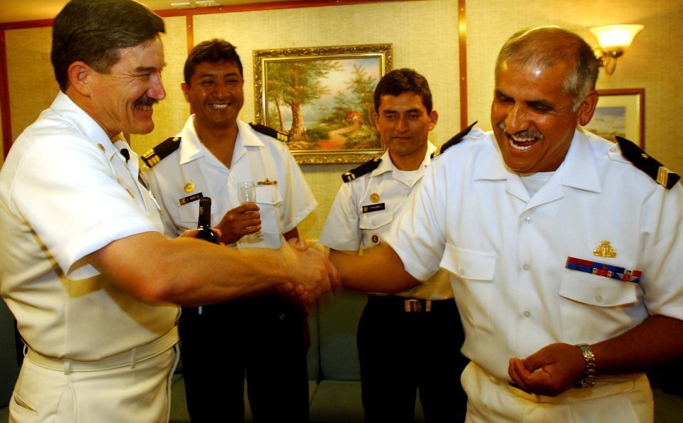 US Navy 050805-F-4883S-005 Master Chief Petty Officer of the Navy (MCPON) Terry D. Scott, left, shares a light moment with Command Master Chief Carlos Arayor, of the Chilean Fast Frigate Almirante Williams (FF 19)