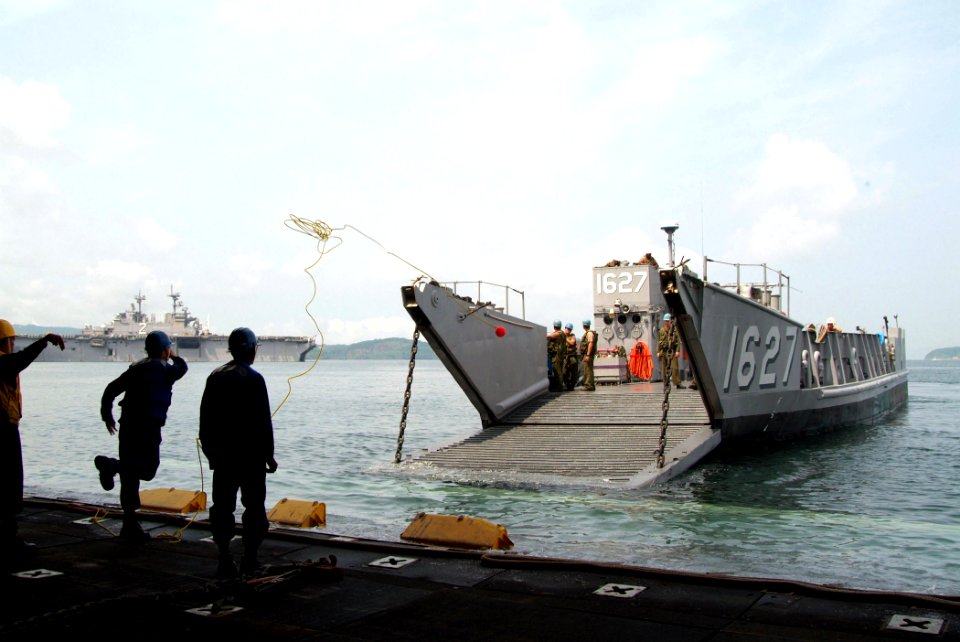 US Navy 050706-N-4772B-064 Landing Craft, Utility (LCU) 1627, assigned to Assault Craft Unit One (ACU-1), prepares to pull into the well deck aboard USS Harpers Ferry (LSD 49)