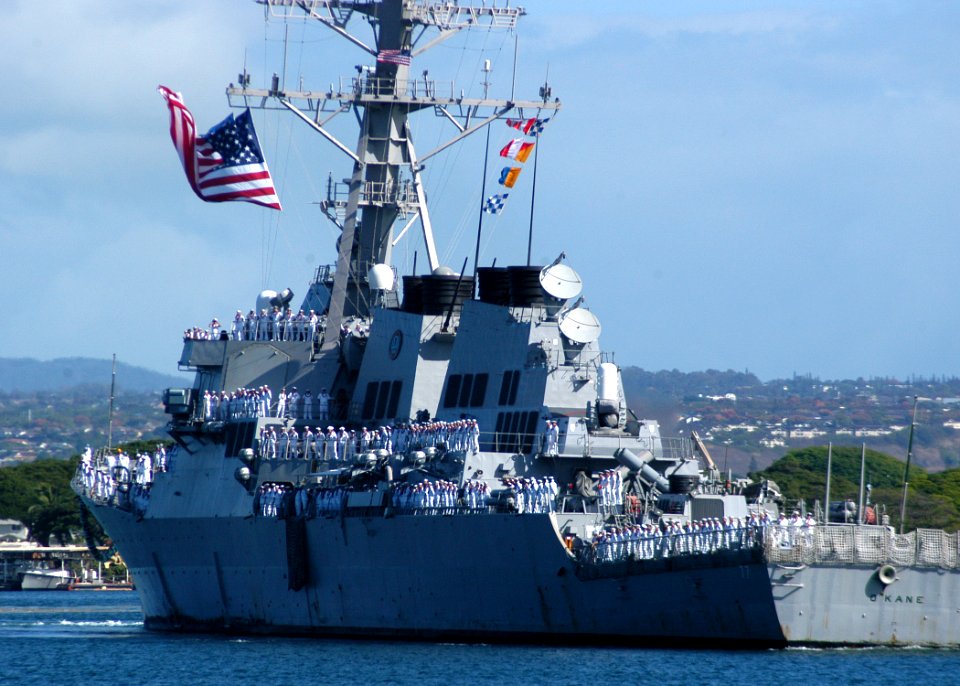US Navy 050729-N-3019M-002 Sailors man the rails aboard the guided missile destroyer USS O'Kane (DDG 77) as the ship returns to Pearl Harbor from a six-month deployment