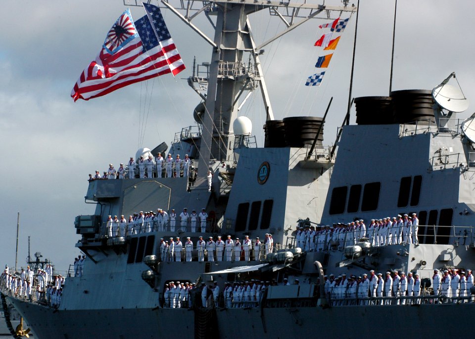 US Navy 050729-N-3019M-004 Sailors man the rails aboard the guided missile destroyer USS O'Kane (DDG 77) as the ship returns to Pearl Harbor from a six-month deployment