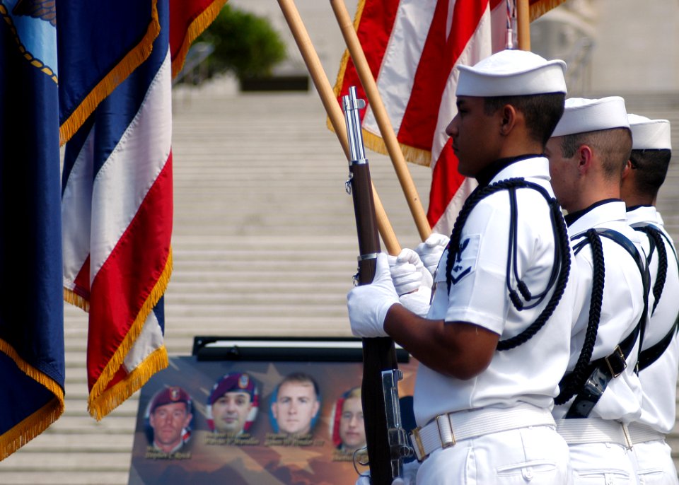 US Navy 050711-N-3019M-003 Sailors assigned to a Naval Station Pearl Harbor color guard present the colors during a memorial service for five Sailors assigned to SEAL Delivery Vehicle Team One (SDVT-1)