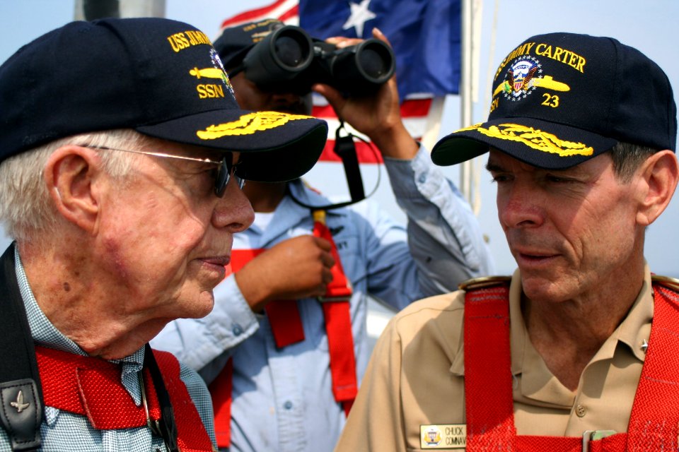 US Navy 050811-N-0653J-003 Former President Jimmy Carter speaks with Commander, Submarine Force, U.S. Atlantic Fleet, Vice Adm. Charles Munns, as they ride out to sea on the bridge aboard the Sea Wolf-class attack submarine USS