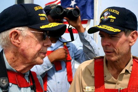 US Navy 050811-N-0653J-003 Former President Jimmy Carter speaks with Commander, Submarine Force, U.S. Atlantic Fleet, Vice Adm. Charles Munns, as they ride out to sea on the bridge aboard the Sea Wolf-class attack submarine USS