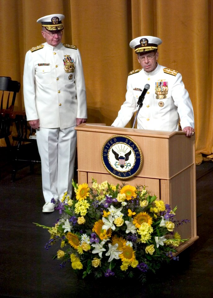 US Navy 050722-N-0295M-015 Adm. Mike Mullen reads his official orders as Adm. Vern Clark looks on during the Chief of Naval Operations change of command ceremony