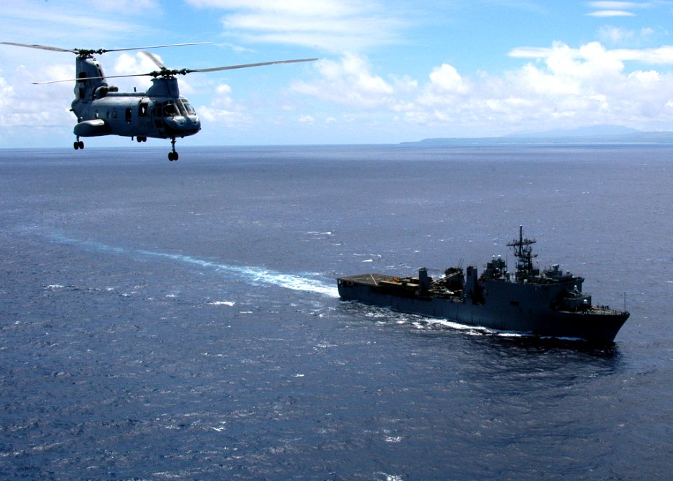 US Navy 050722-N-3019M-004 A U.S. Marine Corps CH-46E Sea Knight helicopter transports media to the dock landing ship USS Pearl Harbor (LSD 52)