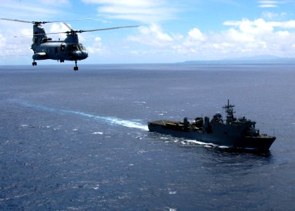 US Navy 050722-N-3019M-004 A U.S. Marine Corps CH-46E Sea Knight helicopter transports media to the dock landing ship USS Pearl Harbor (LSD 52)