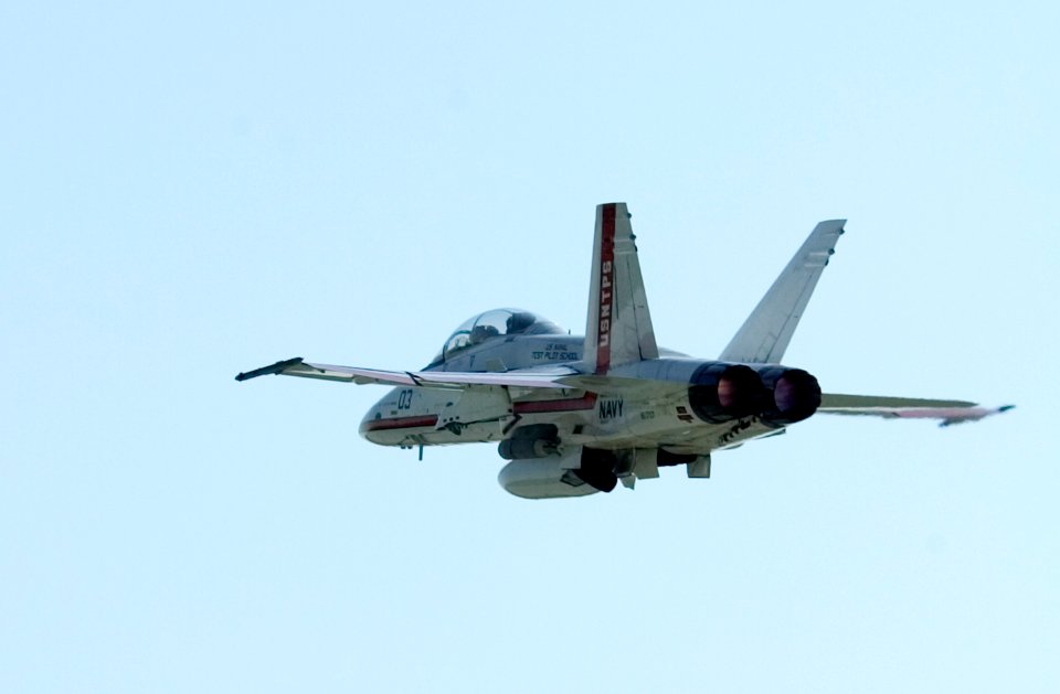 US Navy 050803-N-0295M-154 An F-A-18B Hornet, assigned to the U.S. Naval Test Pilot School, folds up its landing gear while in afterburner after taking off for a training flight from Naval Air Station Patuxent River, Md