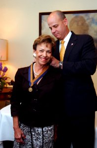 US Navy 050726-N-2568S-001 Under Secretary of the Navy, the Honorable Dino Aviles presents the Meritorious Public Service Award to Mrs. Margaret Dalton in a ceremony held at the Pentagon